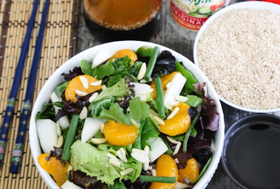MIxed greens salad with mandarin oranges and sesame ginger dressing