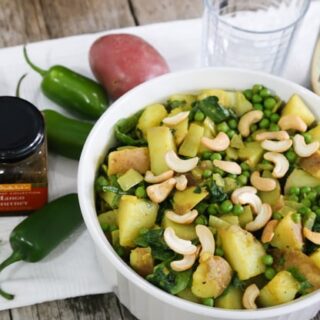 Curried potatoes with peas and cashews