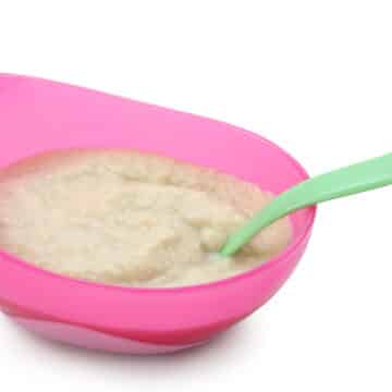 whole grain baby cereal in a colorful bowl