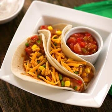 Vegan soft tacos with refried beans and corn