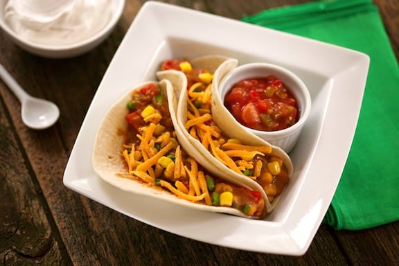 Vegan soft tacos with refried beans and corn