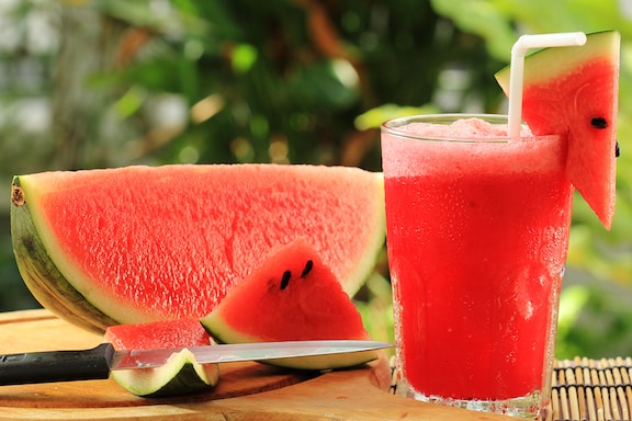 Watermelon strawberry splash Smoothie nest to watermelon slice