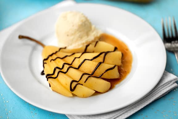 Poached pear with chocolate drizzle