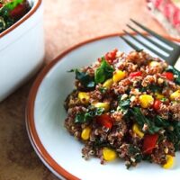 red quinoa pilaf with kale and corn