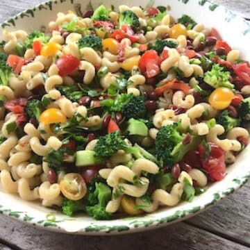 Pasta salad with red beans, tomatoes, and broccoli