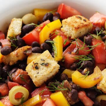black bean salad with tomatoes, croutons, and olives