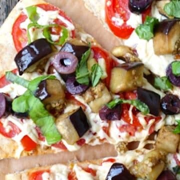 Eggplant, fresh tomato, and olive pizza