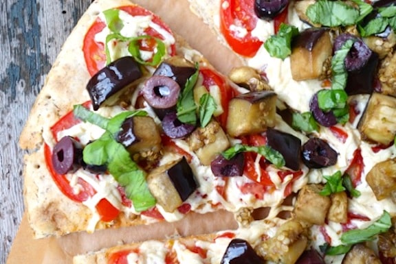 Eggplant, fresh tomato, and olive pizza