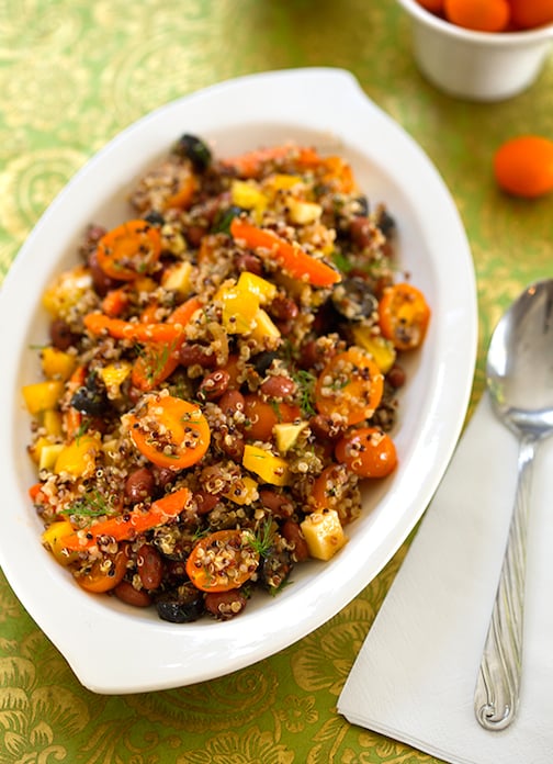 red beans and quinoa being served in a white dish