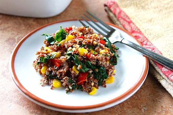 Red quinoa pilaf with kale and corn