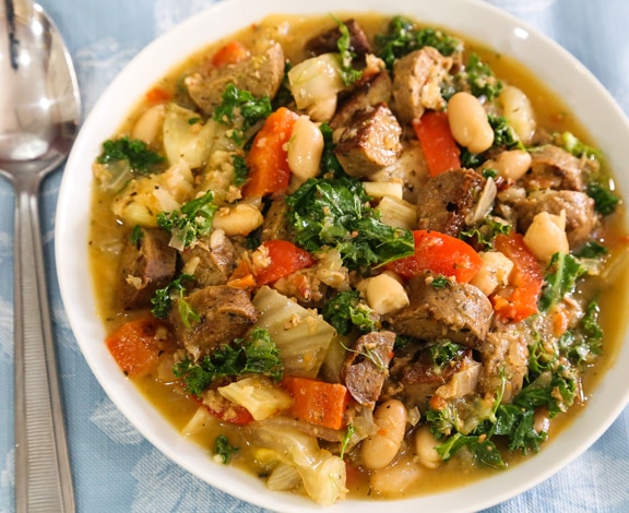 White bean and kale stew with fennel and vegan sausage by Betsy Dijulio
