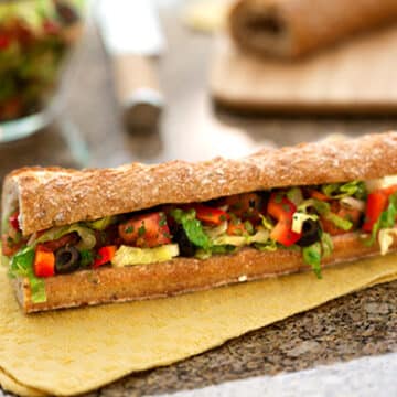 Mediterranean salad-stuffed bread (pan bagnat)