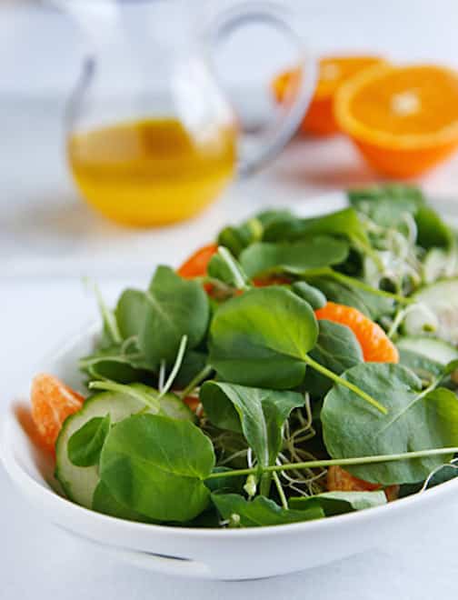 Spring greens salad with cucumbers and oranges