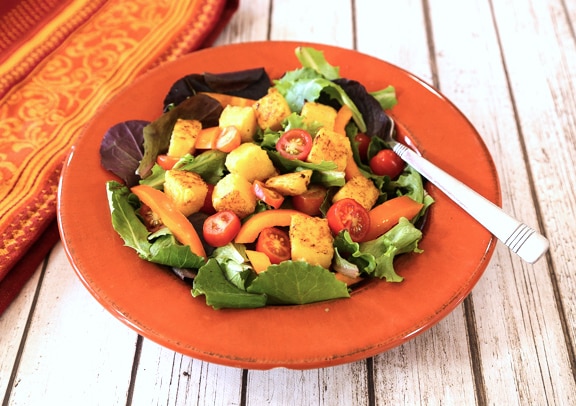 Tube Polenta croutons on salad