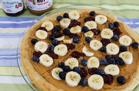 Breakfast peanut butter pizza with fruit and jam 