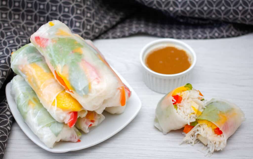 tofu spring rolls stacked on a plate