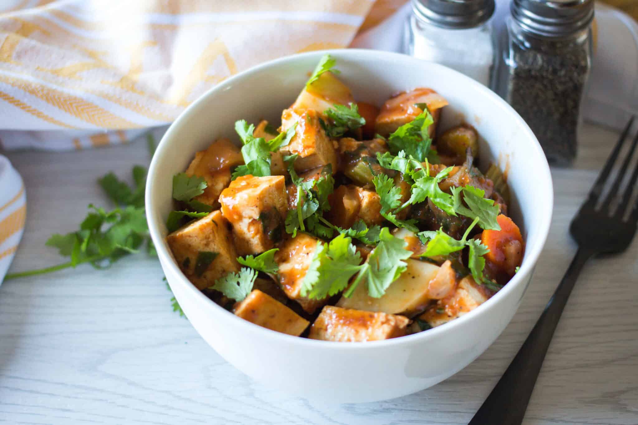 tofu and vegetable stew served in a bowl