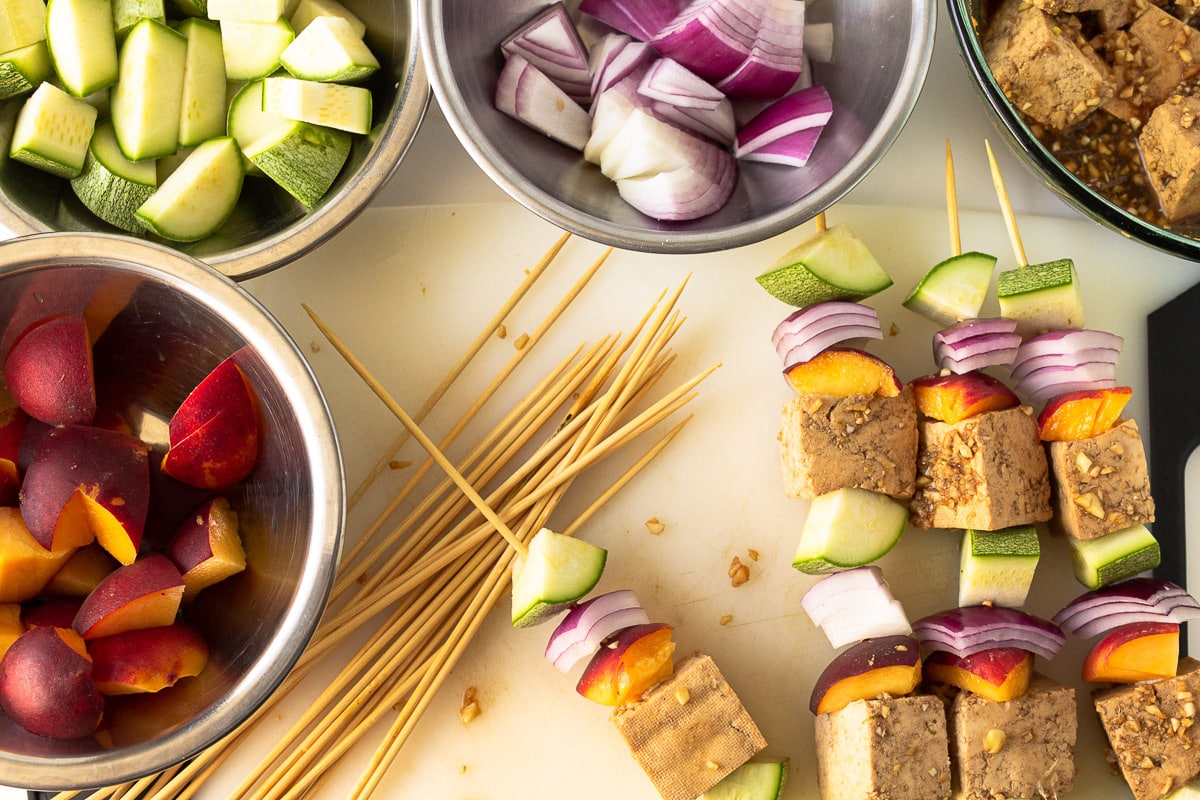 tofu kebabs in progress of being skewered