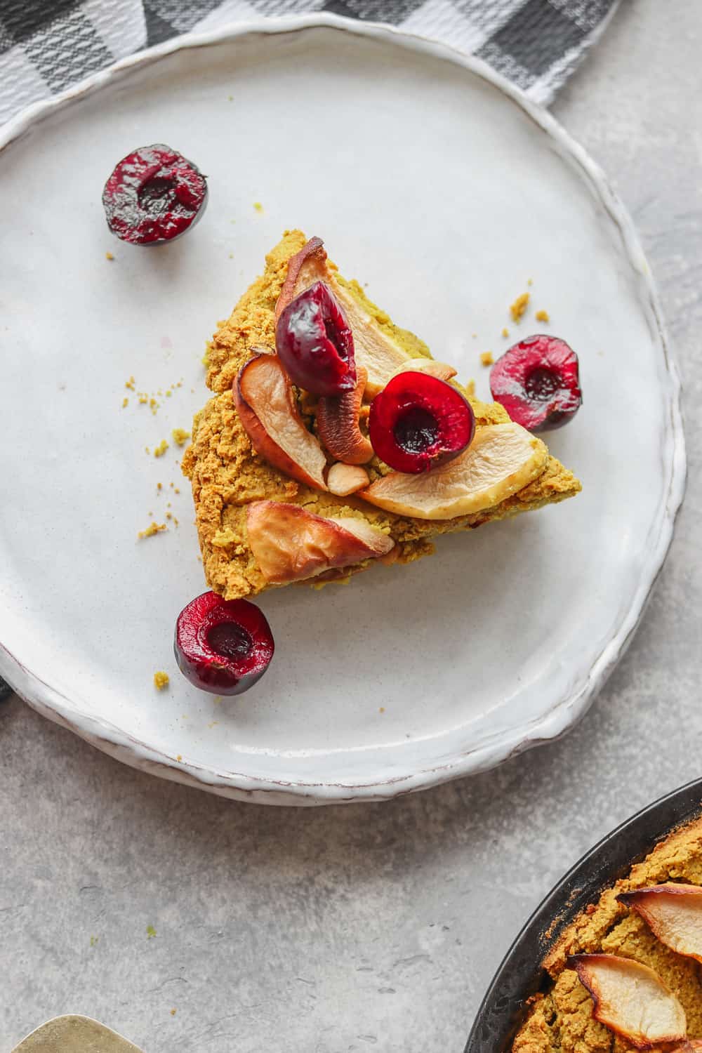 chickpea cake topped with apple and berries