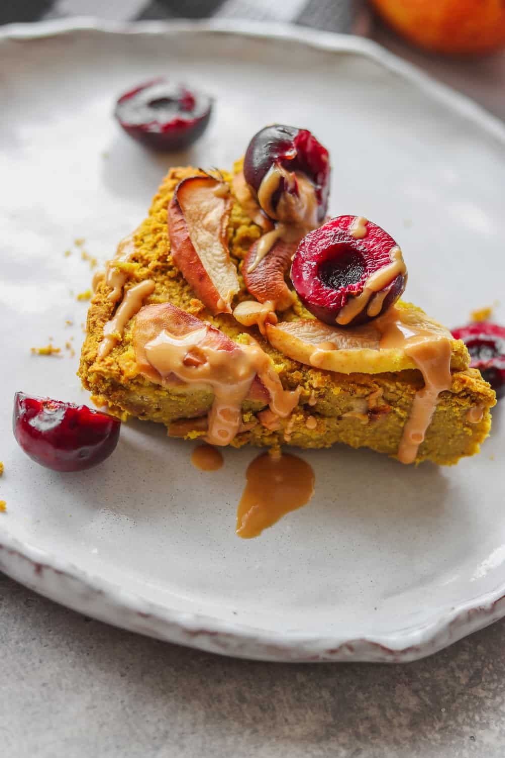 slice of chickpea cake being served on a white plate