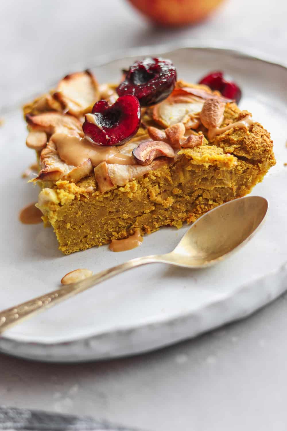 vegan chickpea cake being served on a white dish