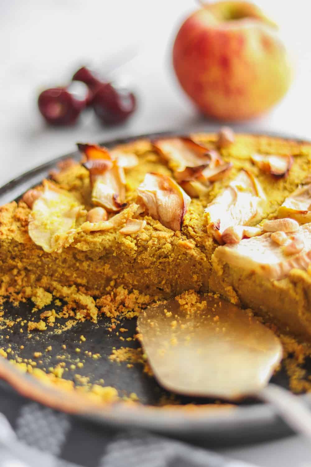 chickpea cake with a spatula serving slices