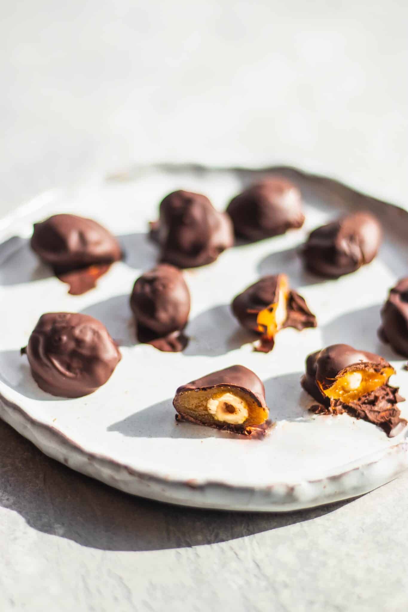  homemade chocolates on a white serving tray