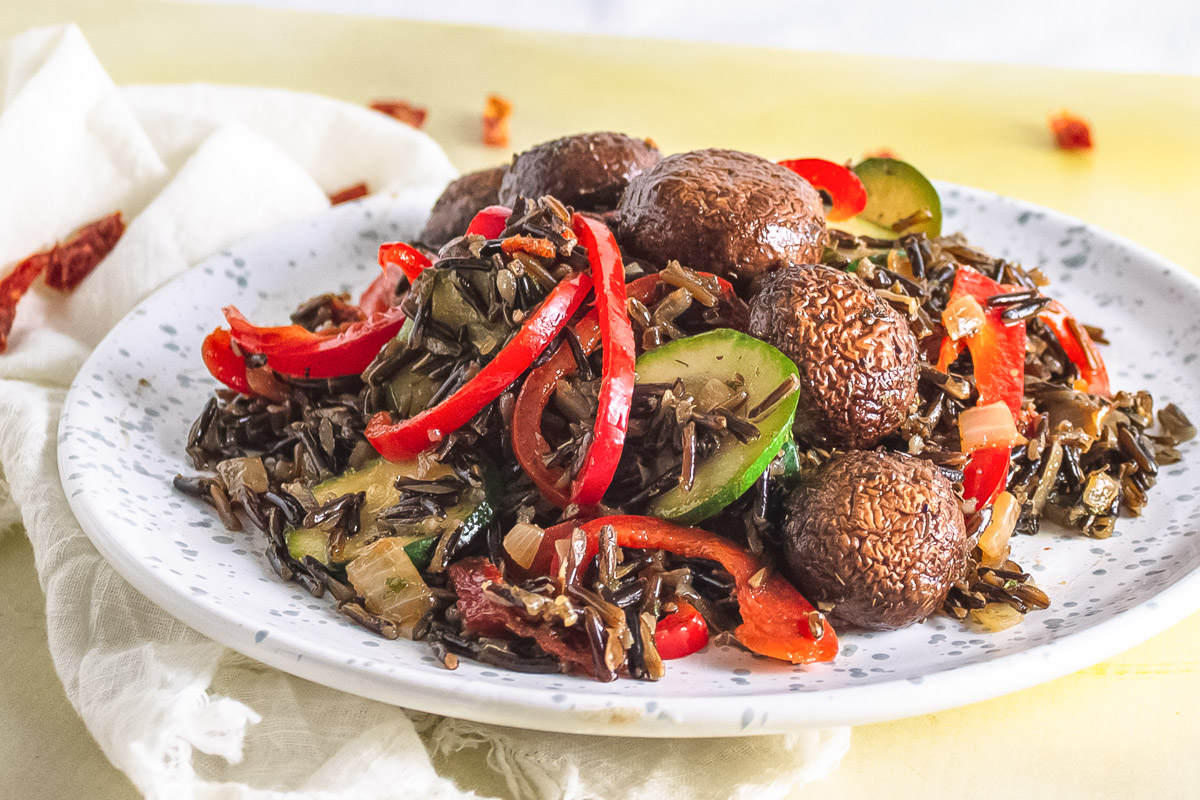 side view of wild rice with mushrooms