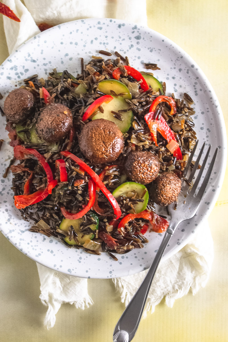 plate of wild rice with marinated mushrooms