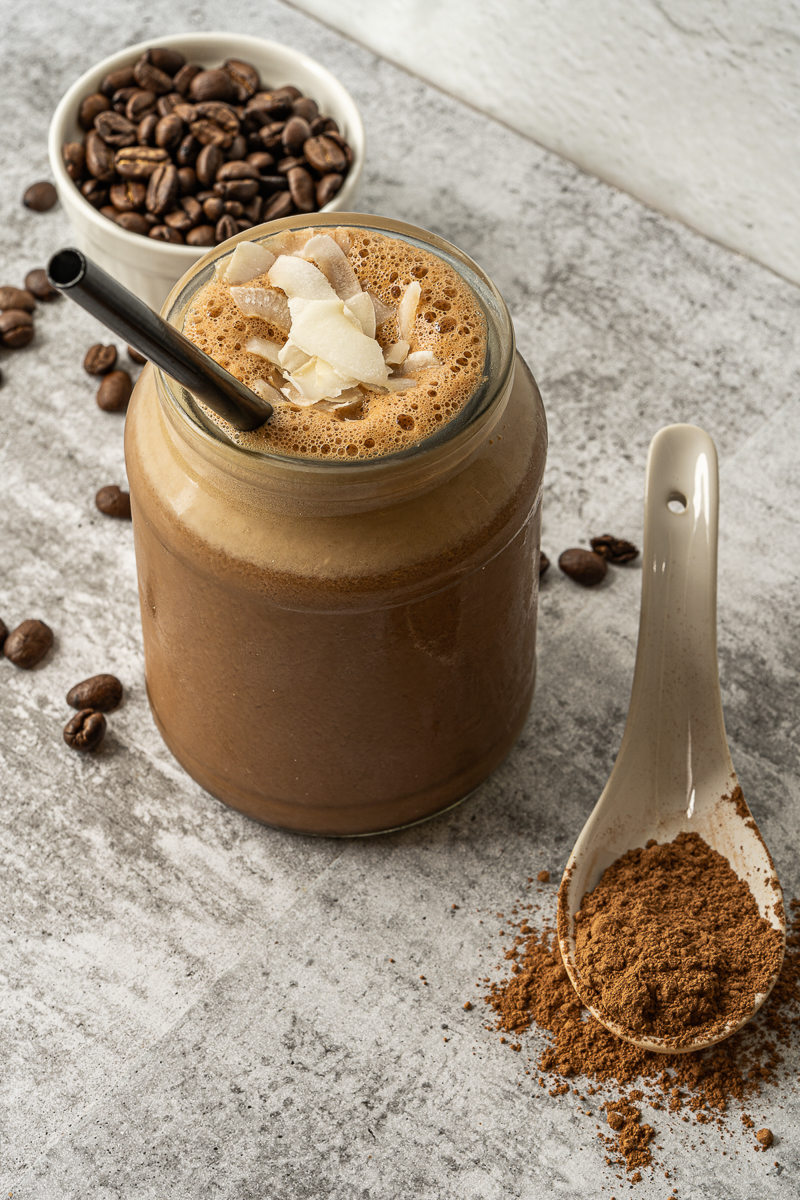 close up vegan chocolate shake with coconut flakes