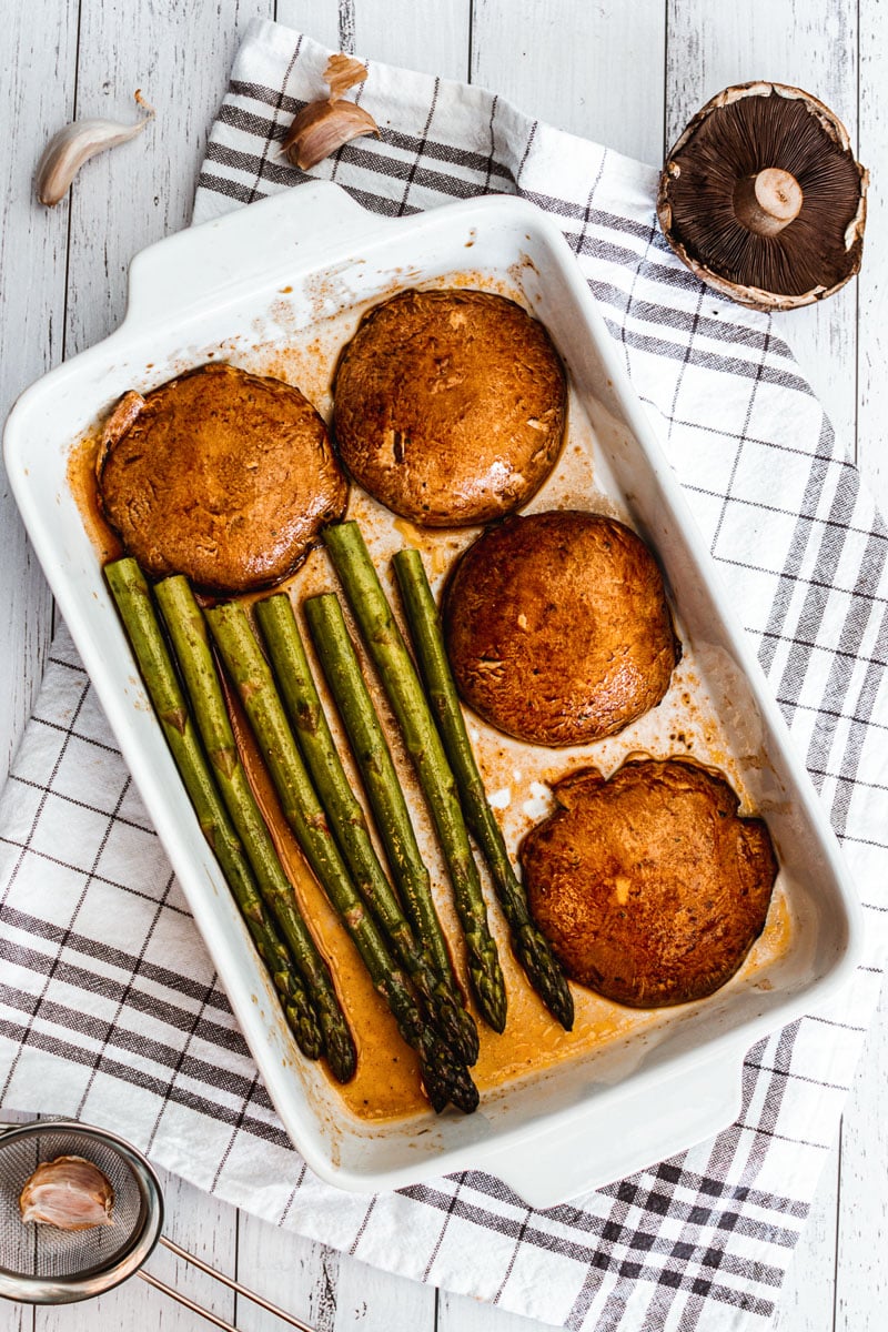 pan with portobello mushroom steaks and asparagus