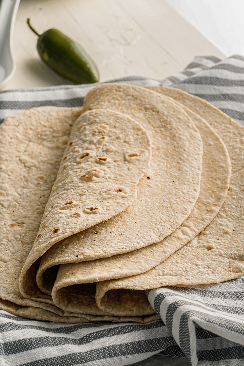 folded stack of homemade flour tortillas