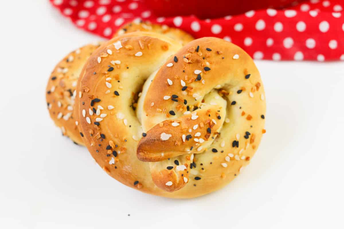 vegan soft pretzel on white background with red napkin