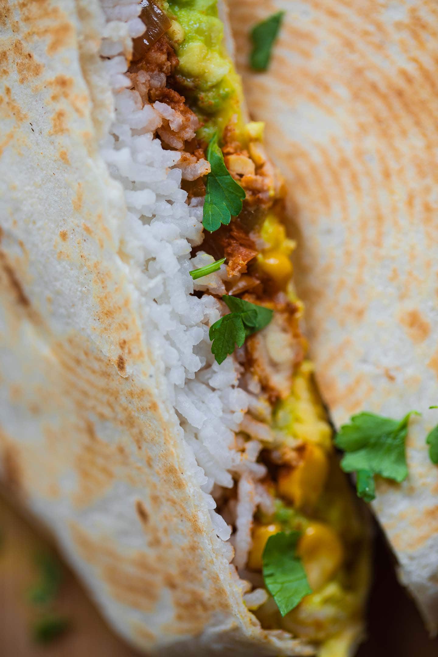 Closeup of a Crunchwrap with tempeh and rice