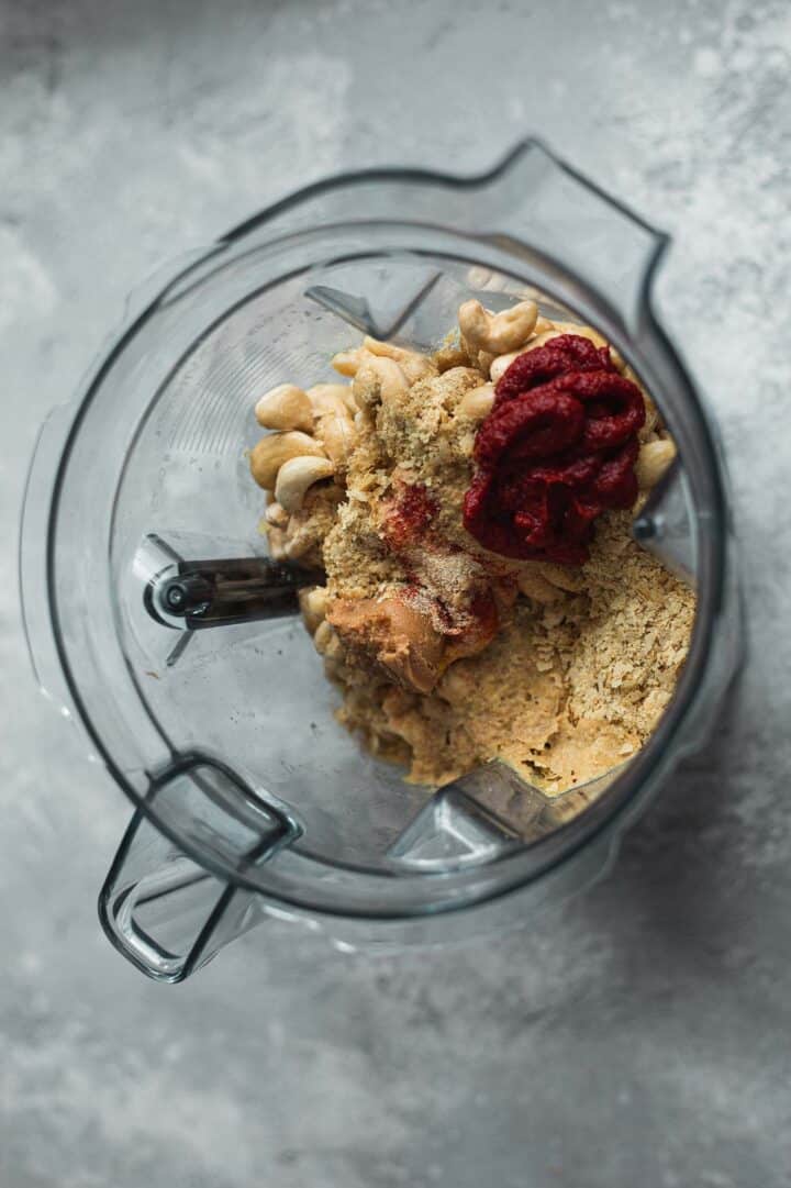 Ingredients for a vegan cheese sauce in a blender