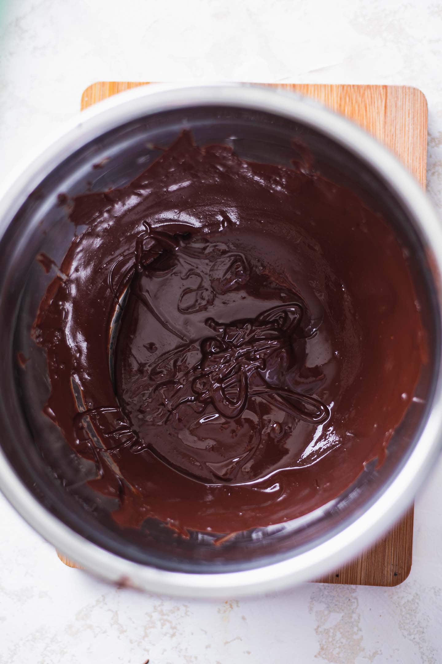 Melted dark chocolate in a mixing bowl