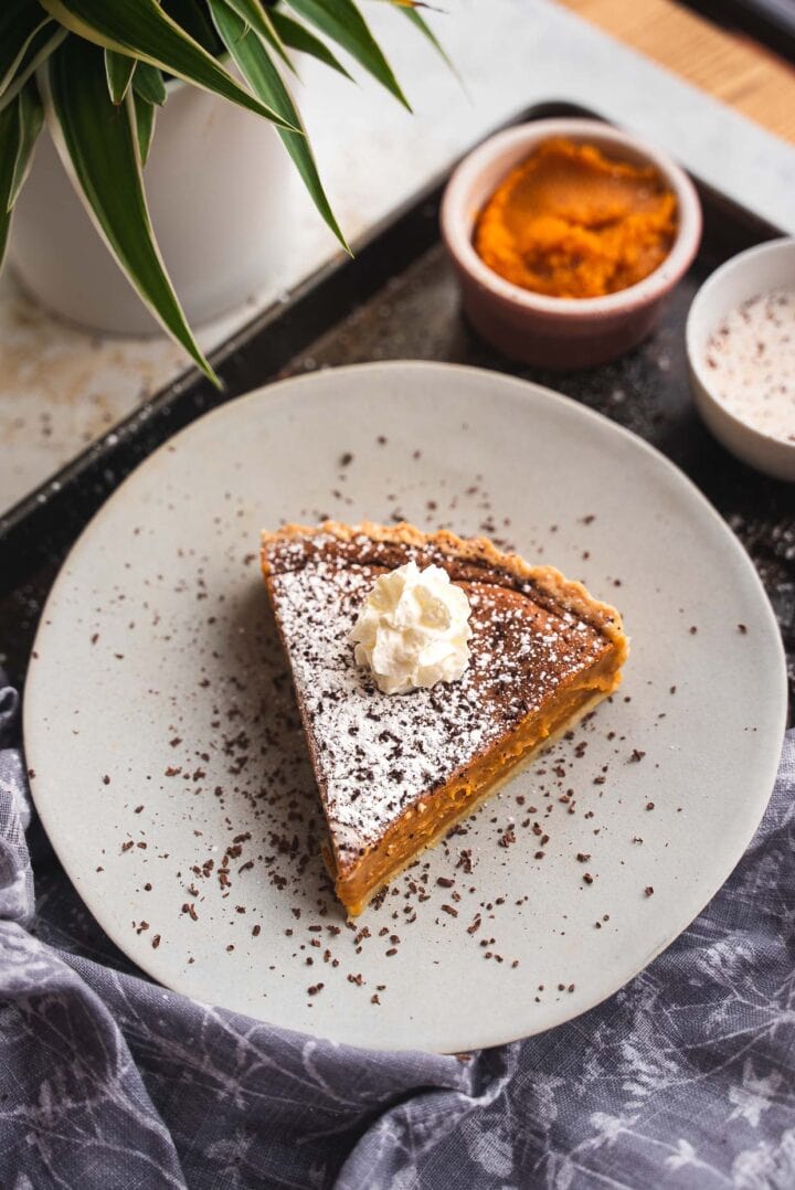 Slice of vegan pumpkin pie on a plate