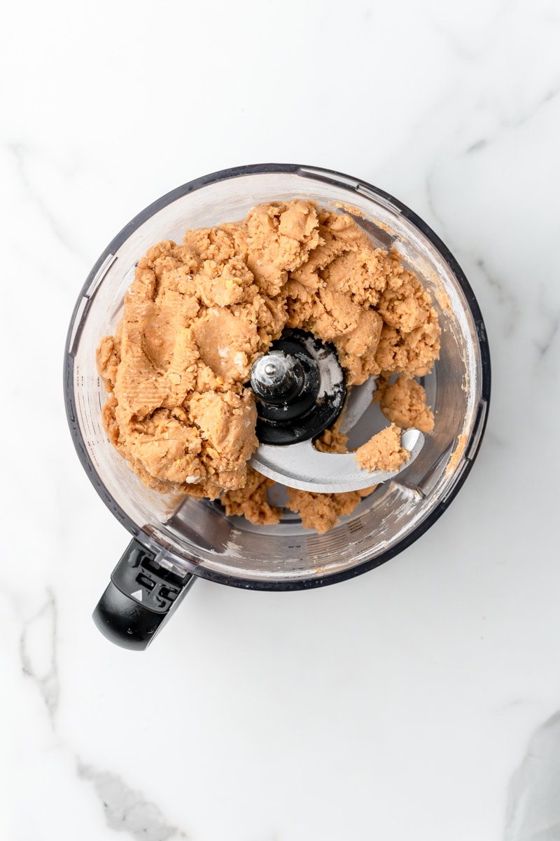 Smooth chickpea cookie dough blended in a food processor