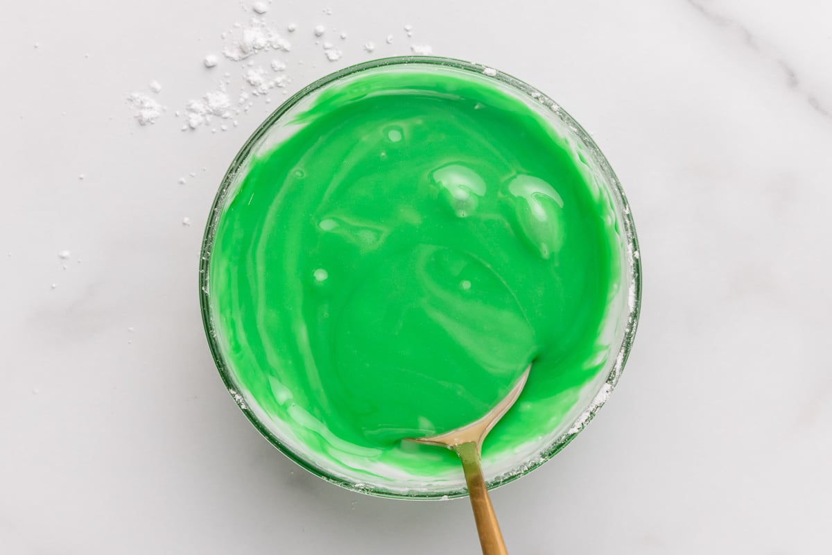 adding food coloring to the icing