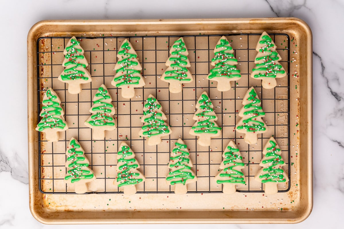 adding sprinkles to the vegan christmas cookies