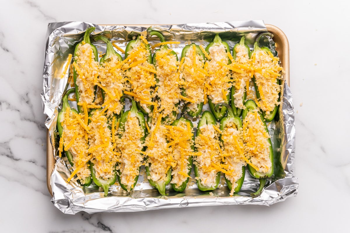 stuffing the vegan jalapeno peppers