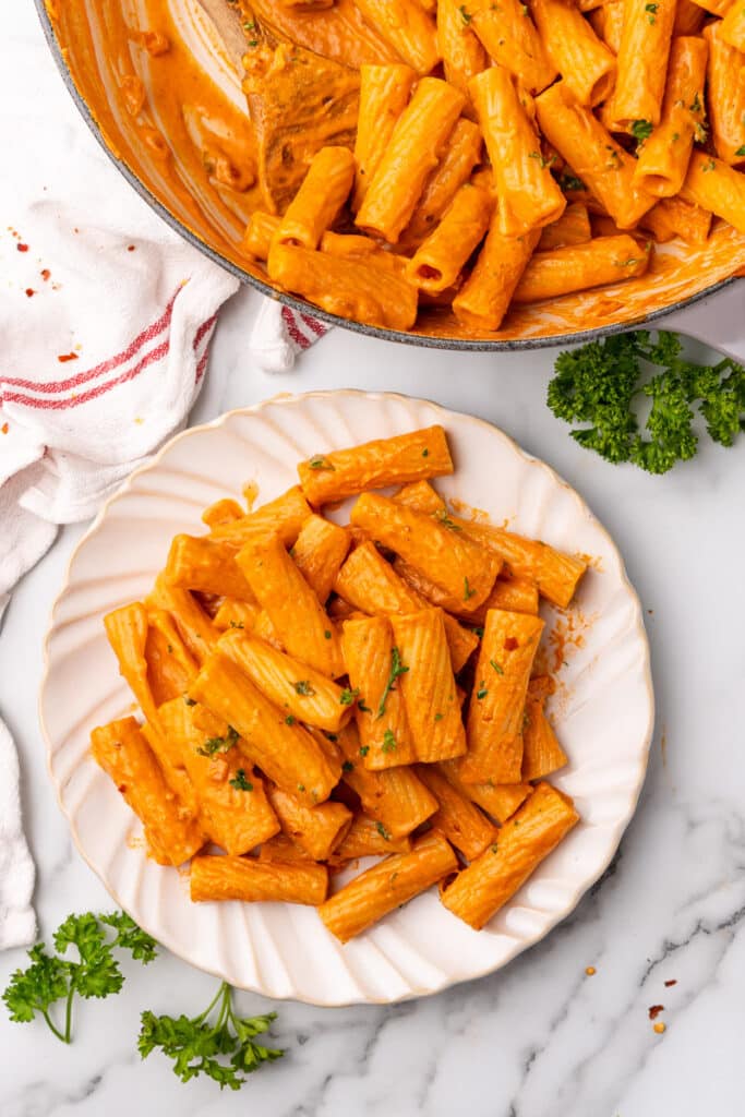 vegan vodka pasta being served on a plate