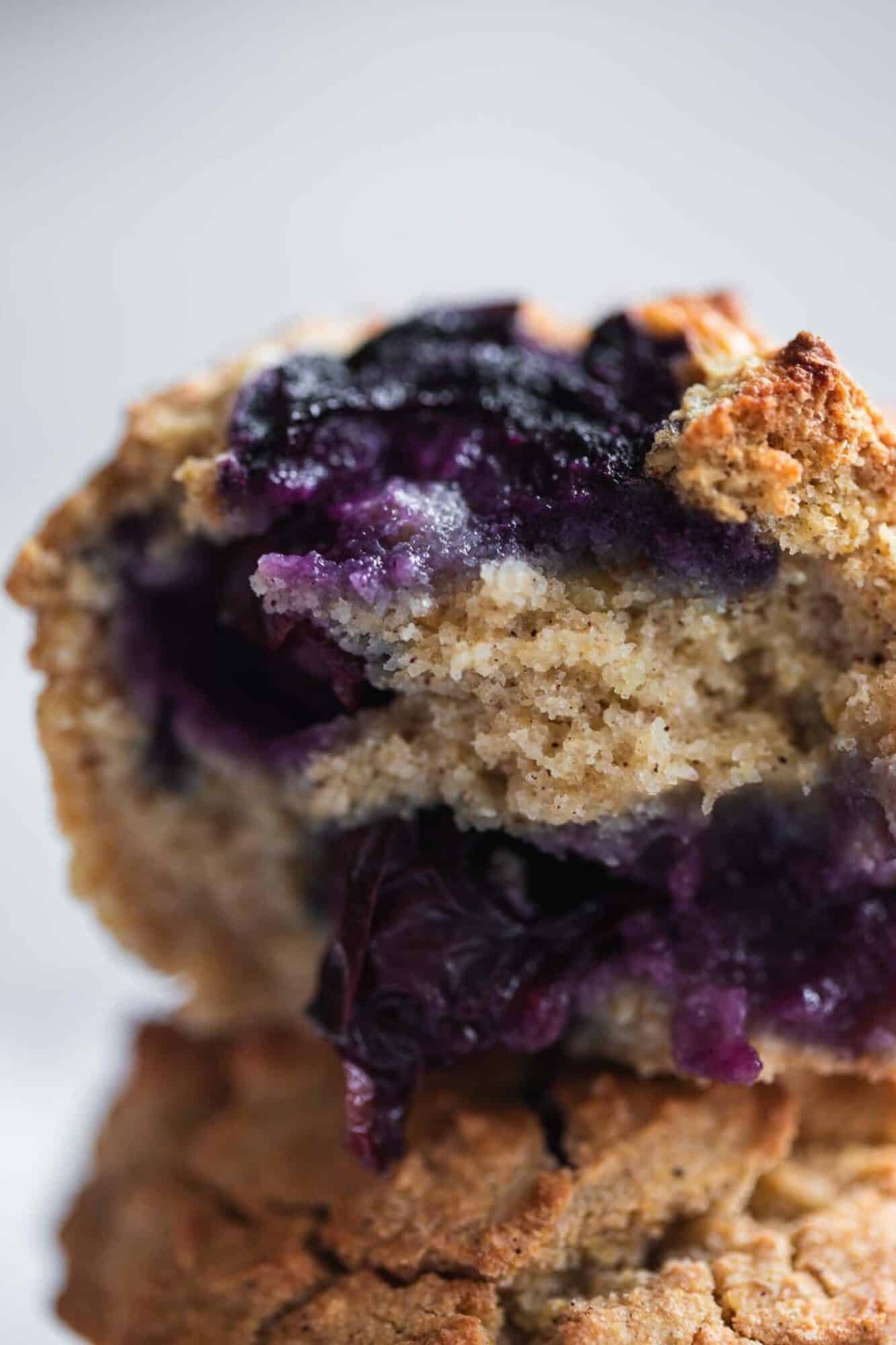 vegan blueberry muffin with a bite taken out of it