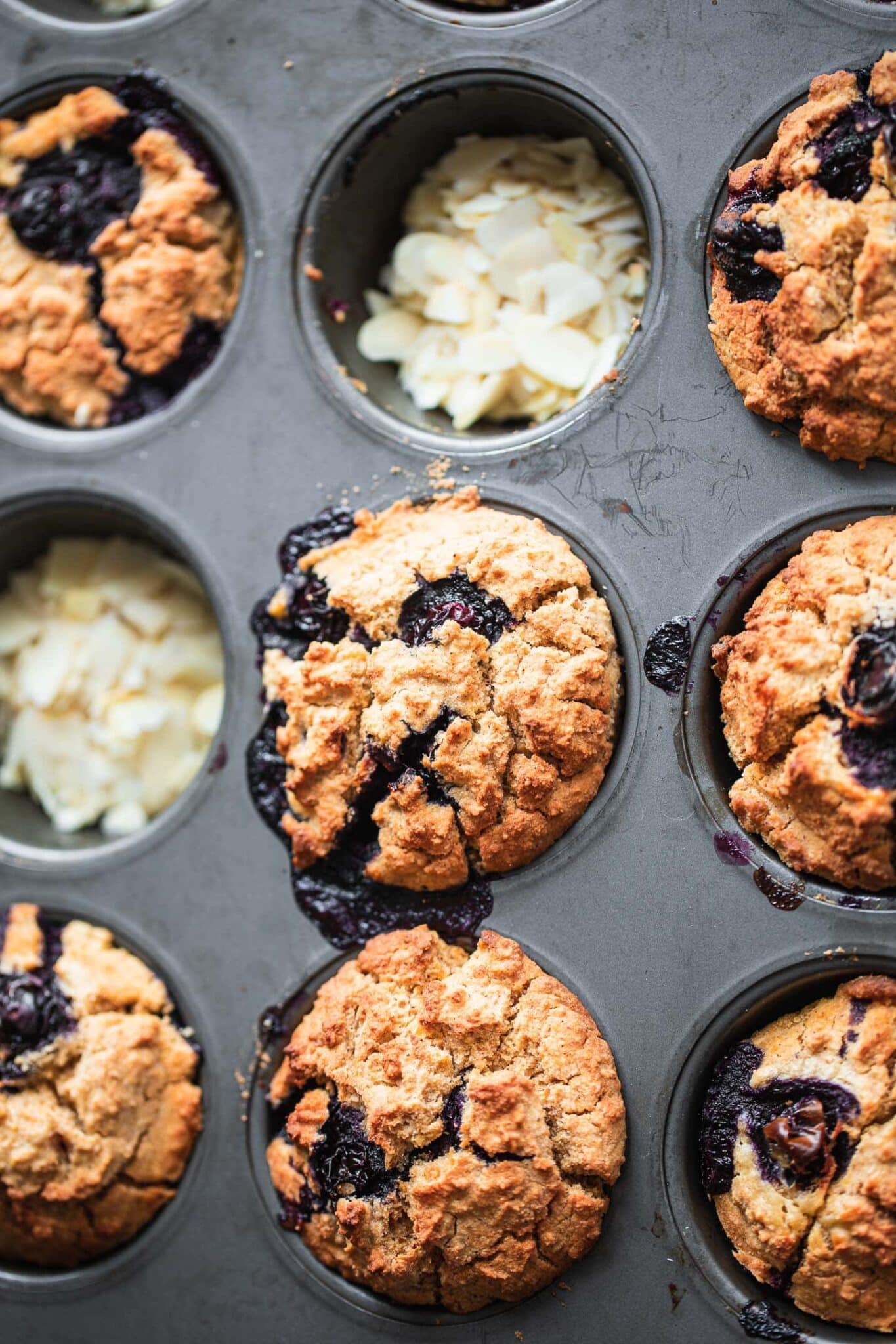 vegan blueberry muffins in a muffin tin