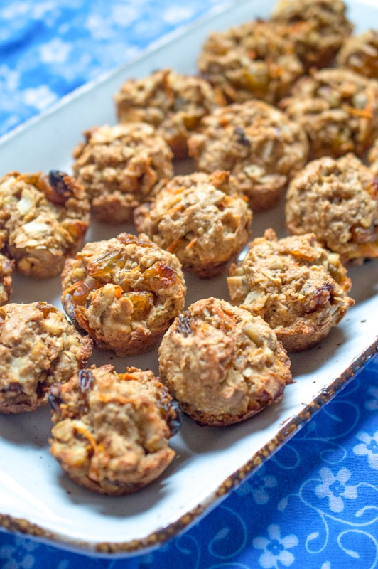 healthy carrot muffins being served on a platter