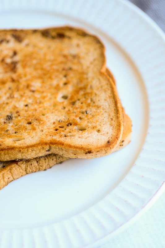 vegan french toast being served on a white plate