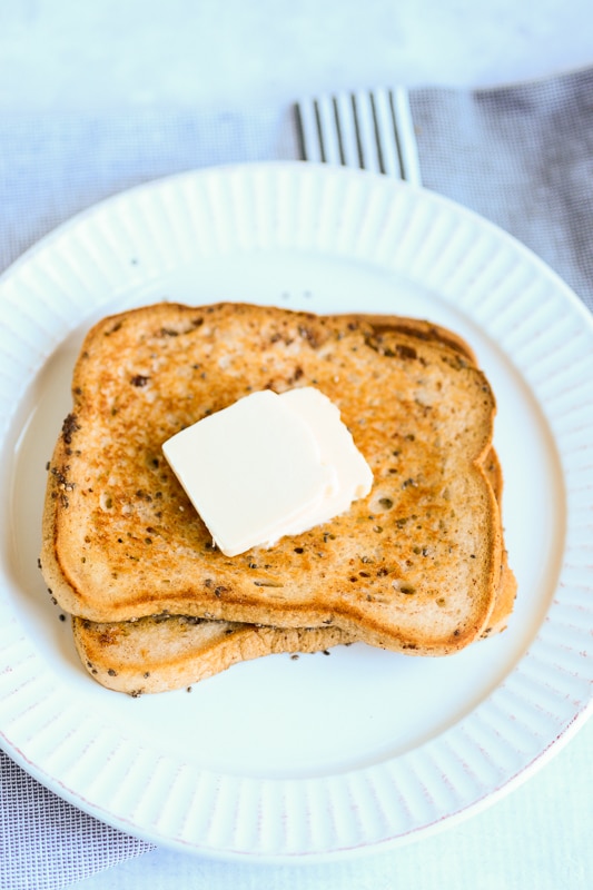 vegan french toast with vegan butter on a plate