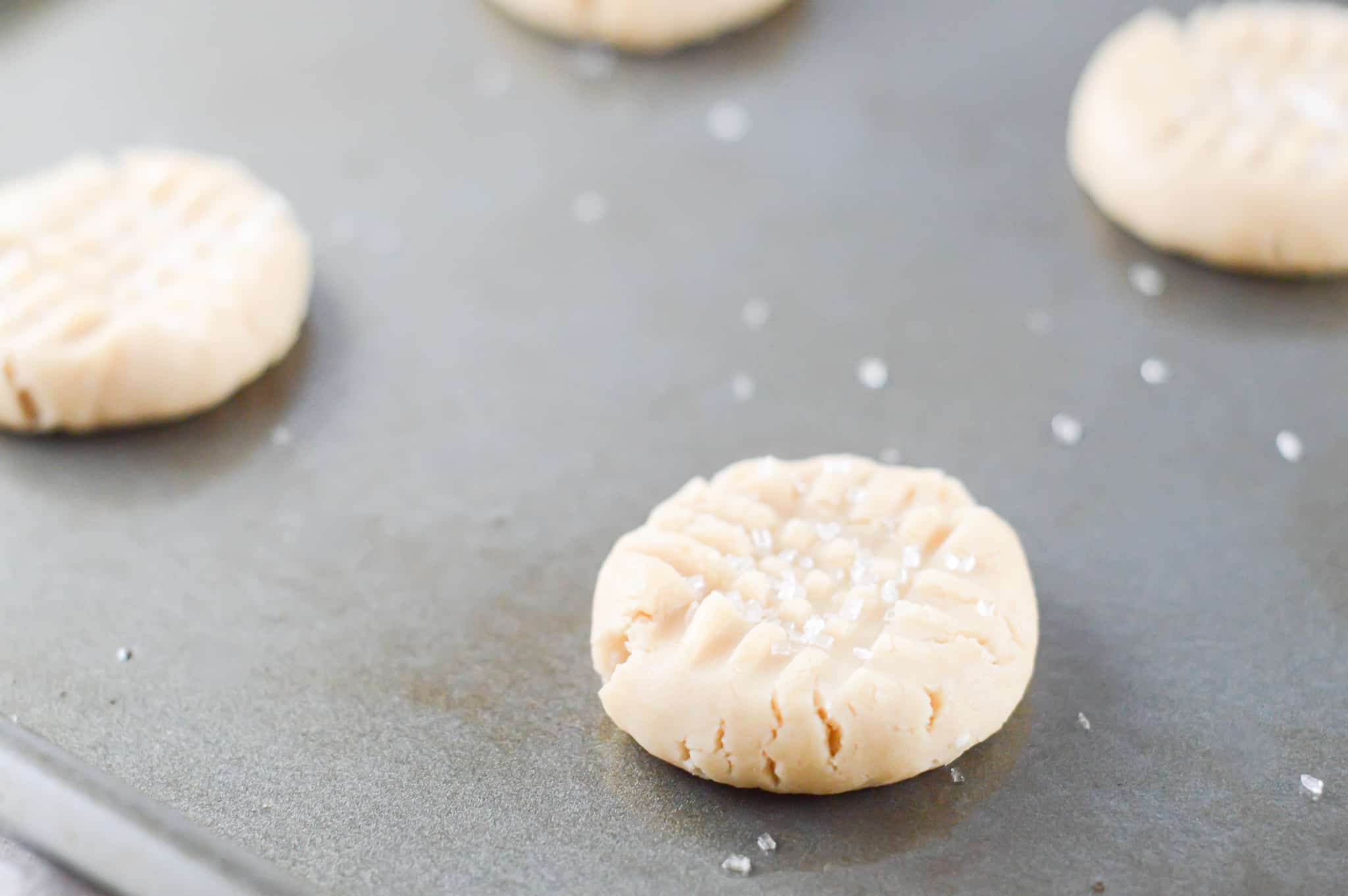 unbaked vegan sugar cookie dough on a baking sheet