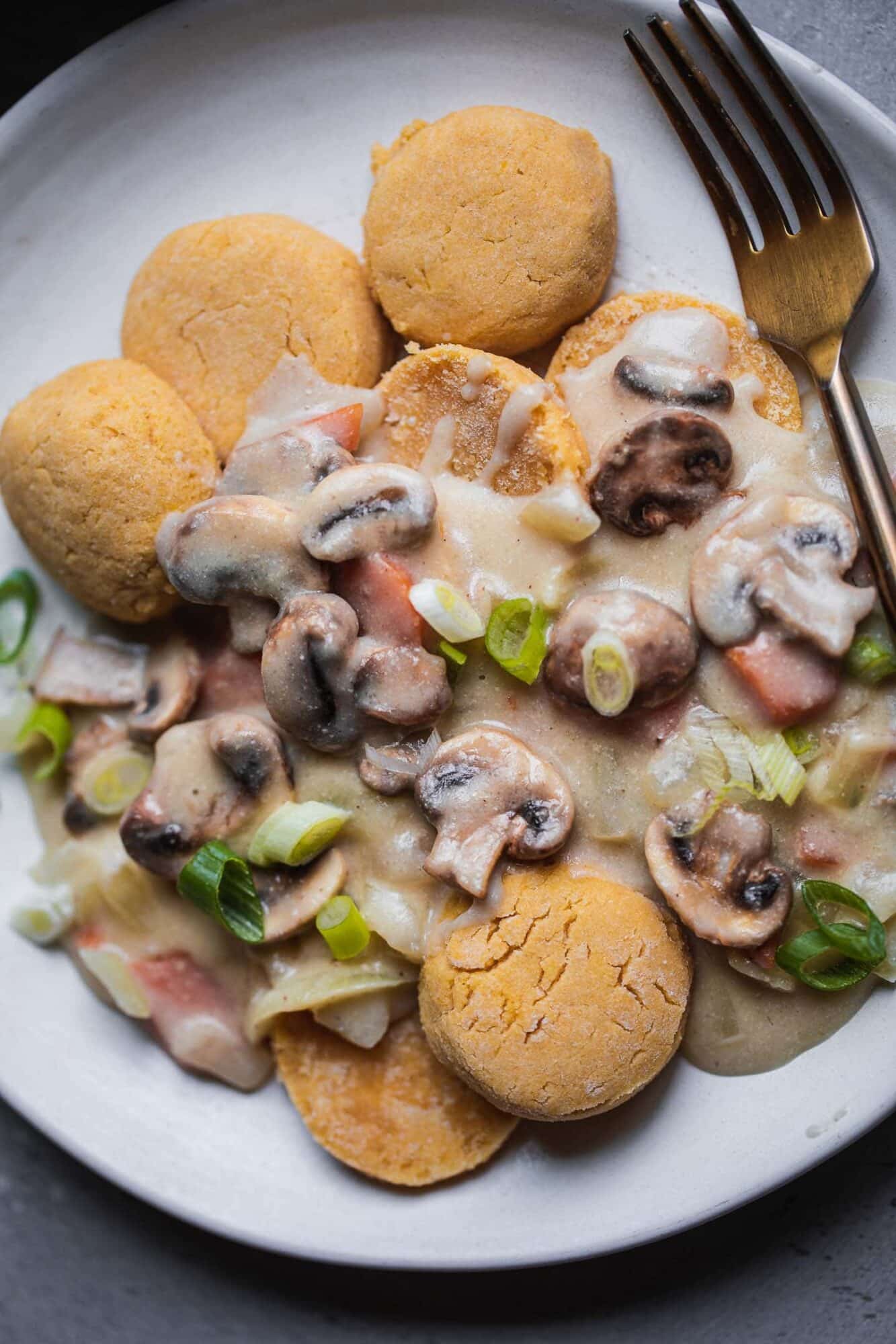 Plate of gluten-free vegan biscuits with mushroom gravy