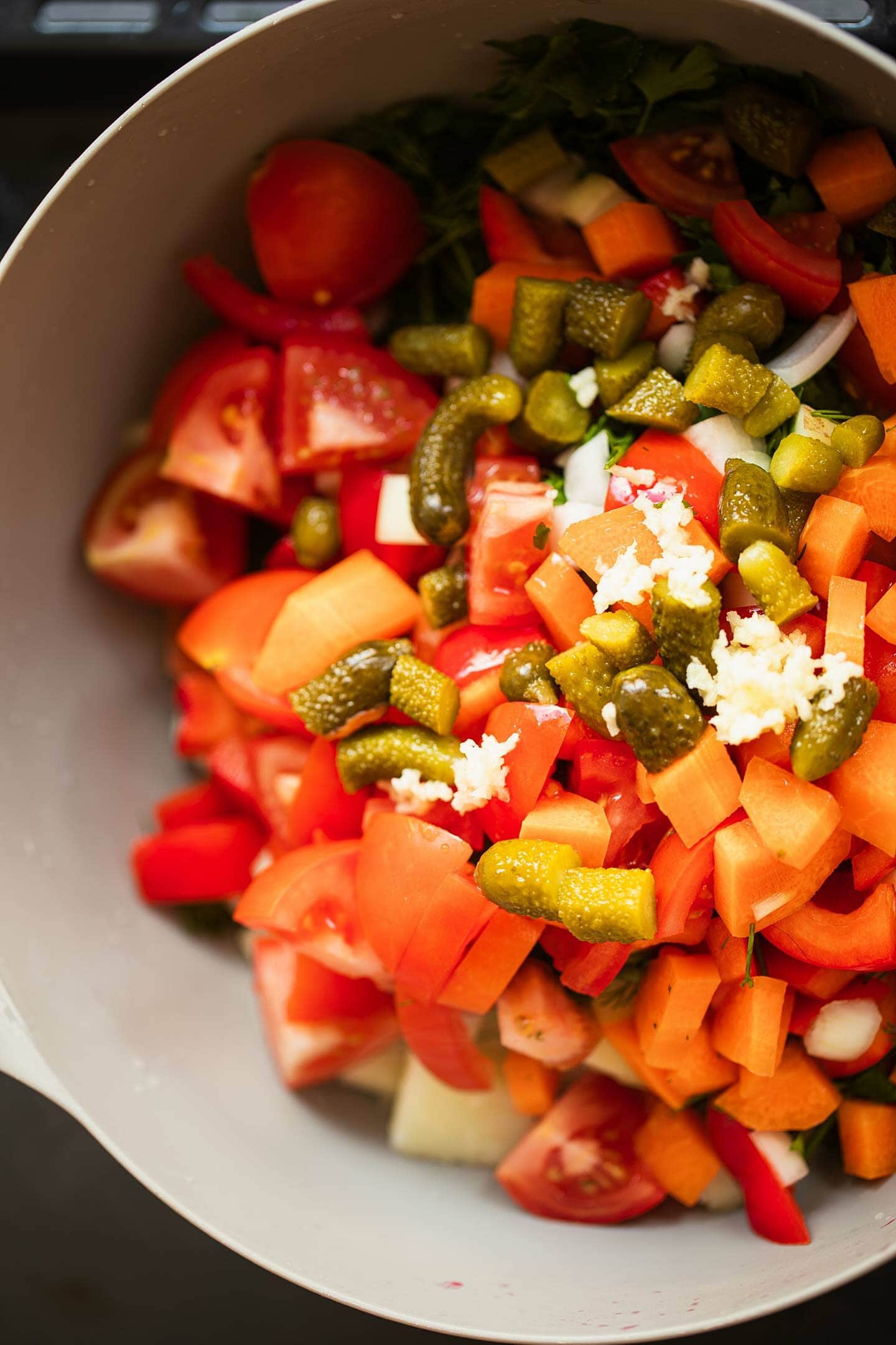 Potatoes and vegetables in a mixing bowl